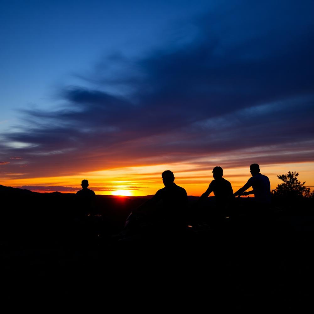Group of riders at sunset